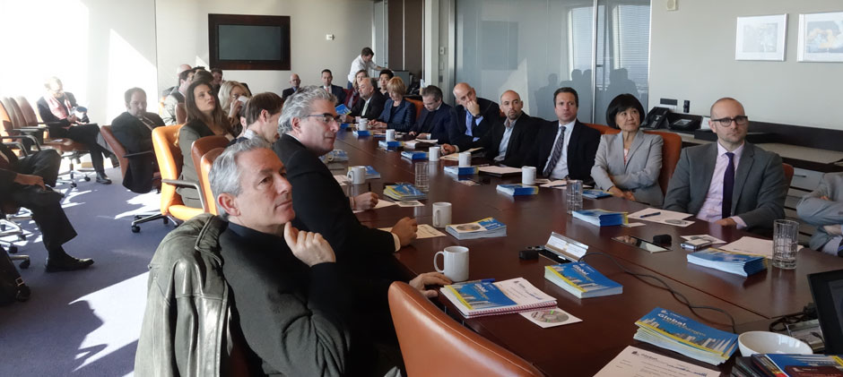 The Steering Committee meets in the boardroom of The Durst Organization in the Bank of America Tower